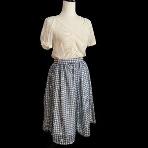 Unique Vintage Magnolia Place. Blue gingham knee-length skirt & sewn on flowers.